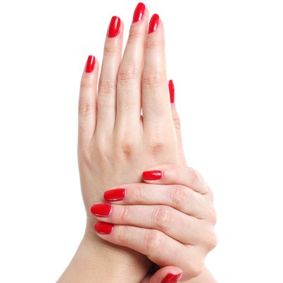 Beautiful woman's hands with red manicure isolated over white background